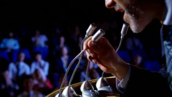 Caucasian businessman speaking in business seminar on stage in auditorium 4k