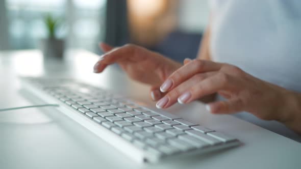 Accelerated Video of Female Hands Typing on a Computer Keyboard