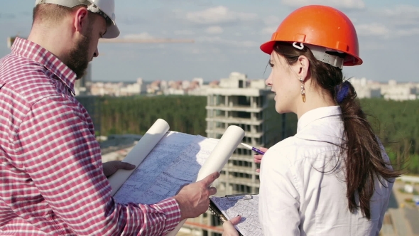 Architect and Engineer Looking on Project