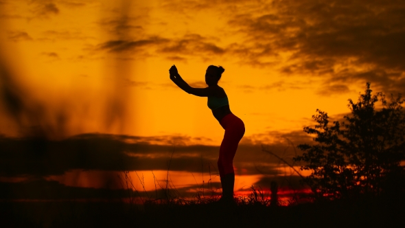 Carefree Woman Dancing In The Sunset. Vacation Vitality Healthy Living Concept.