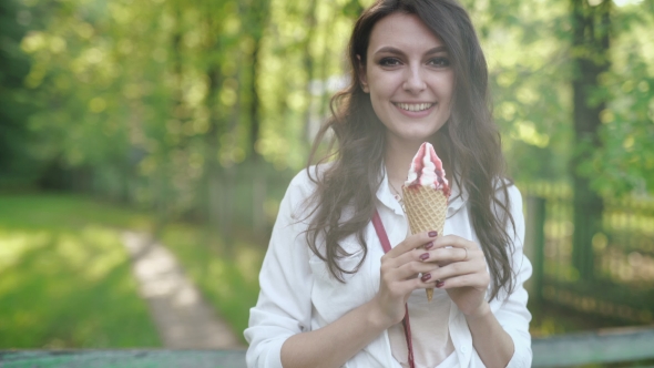 Portrait Of Young Happy Woman Eating Ice-cream, Outdoor