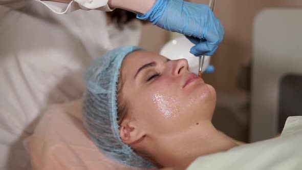 Woman in a Spa Getting Facial Mask