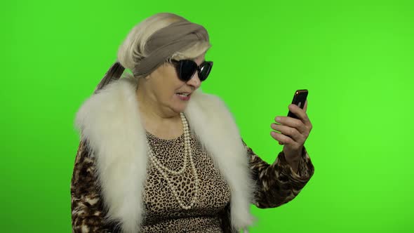 Elderly Caucasian Grandmother Use Smartphone for Talking Video Call. Chroma Key