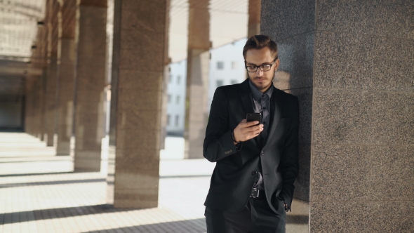 Casual Urban Professional Businessman Using Smartphone