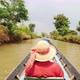 Young Tourist Woman Floating on the River on Old Wooden Boat. Wild Tourism Adventure Natural - VideoHive Item for Sale