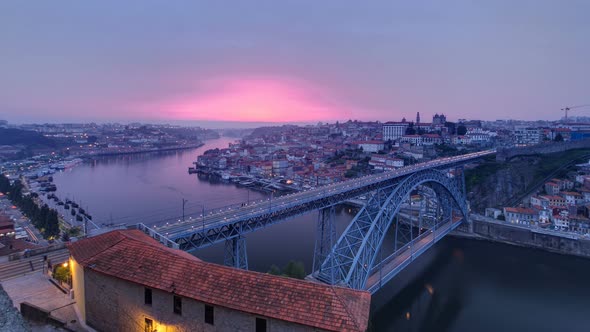 Day To Night View of the Historic City of Porto Portugal Timelapse with the Dom Luiz Bridge