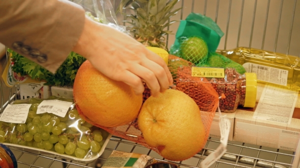 Shopping Trolley Being Filled With Groceries And Healthy Food