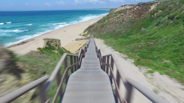 Walk Down Via Wooden Stairs With Railing