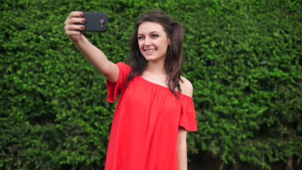 Portrait Of Sexy Young Woman In Red Dress