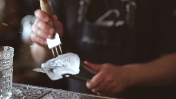 Bartender Mannually Crushed Ice With Wooden Metal Knife.