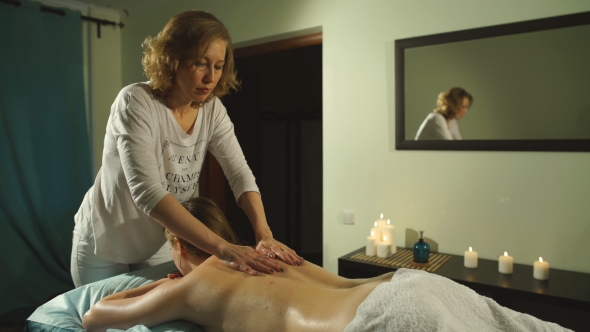 Woman Getting a Back Massage With Oil