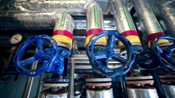 Valves, Pipes, Gauges At a Gas And Oil Production Plant