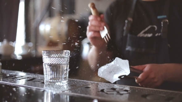 Bartender Mannually Crushed Ice With Wooden Metal Knife.