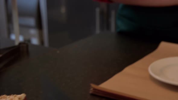 Festive waitress smiling at camera