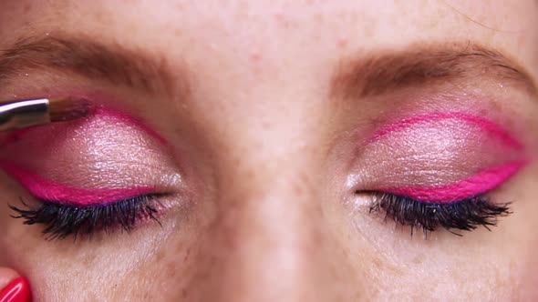 Closeup of the Eyes of a Young Woman During Professional Makeup