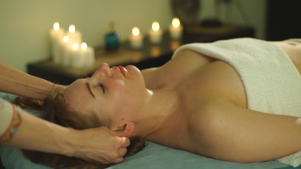 Woman Doing The Massage Of The Ears