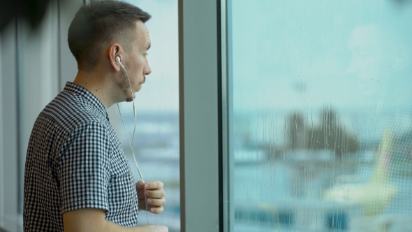 Young Traveler Is Waiting At The Airport alt