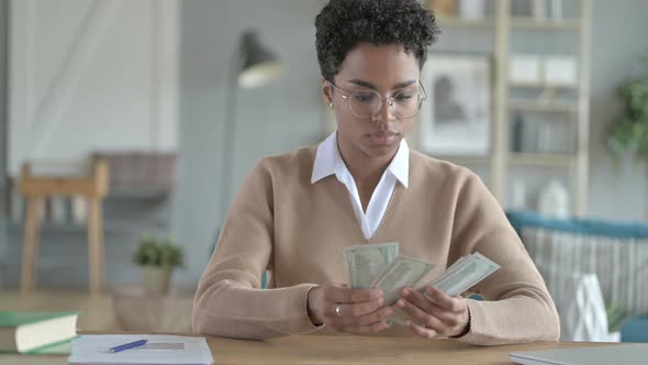 Young African Girl Counting The Money