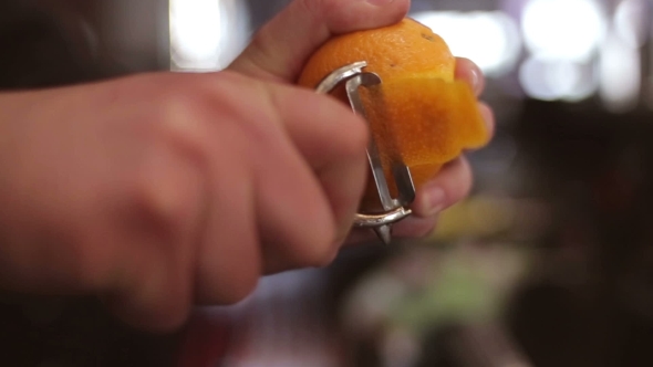 Bartender Make Citrus Garnish On The Bar