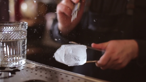 Bartender Mannually Crushed Ice With Wooden Metal Knife.