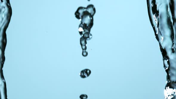 Water pouring and splashing in ultra slow motion 1500fps on a reflective surface - WATER POURS 