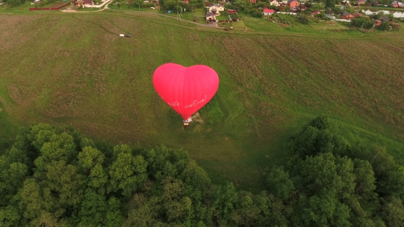 Hot Air Balloon In The Sky Over a field.Aerial View alt