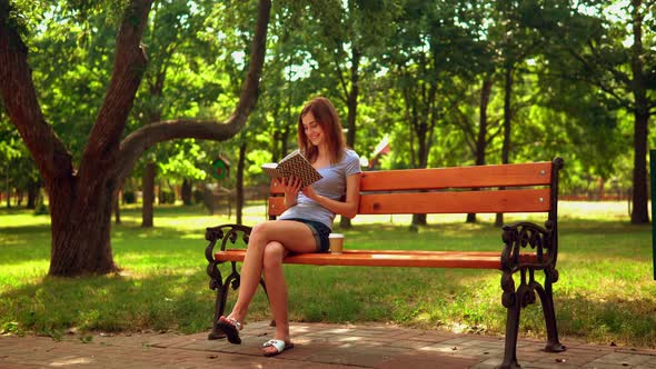 Female Reads Laughable Novel Outdoors