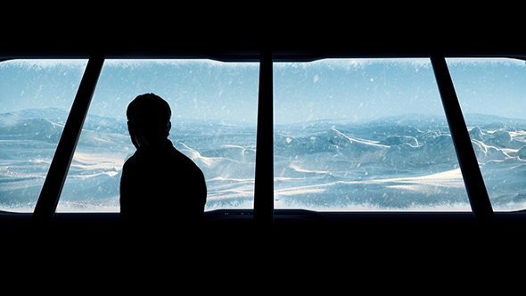 Man Looks Out From Arctic Base