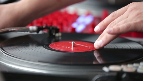 Hands Of a Disc Jockey On The Professional Mixing Controller