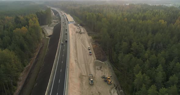 Road Construction New Highway Aerial View in Middle of Green Forest