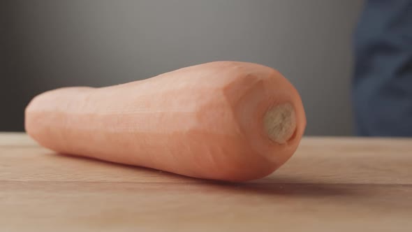 Carrot on Wooden Board