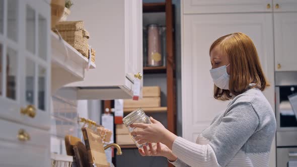 Woman in Medical Mask Furniture Store