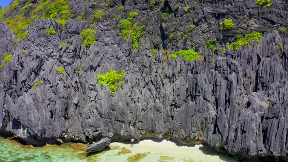 Jagged Limestone Cliffs of Matinloc Island at Palawan, Philippines