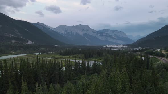 Bow River winding through the incredible Rocky Mountains at blue hour in the countryside of Alberta,