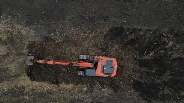 Crawler excavator front view digging on construction site