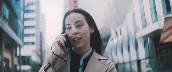 Woman walks while speaking on the phone