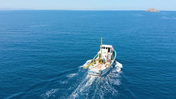 A Small Fishing Boat Goes To the Open Sea To Search for and Catch Salmon.