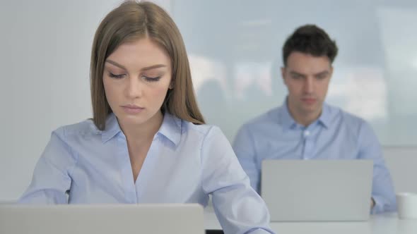 Young Businesswoman Looking at Camera in Office