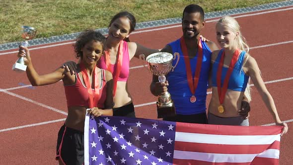 Multiracial Sport Team From Usa Showing Cups and Trophies, Competition Victory