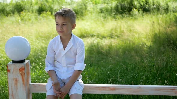 little boy dancing on a summer day