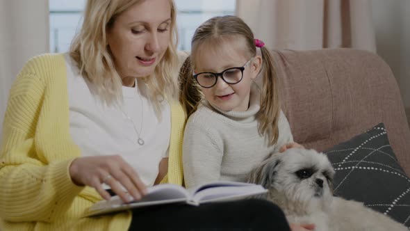 Mother Read Book for Daughter Girl Stroking Dog and Listening to Fairytale