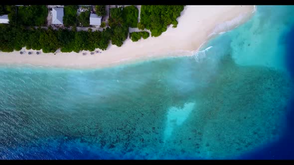 Aerial landscape of paradise island beach trip by blue ocean with white sandy background of a daytri