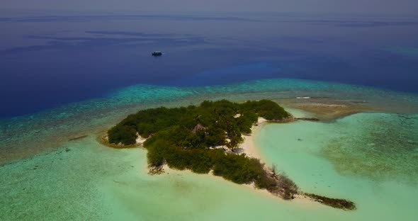 Beautiful aerial island view of a sunshine white sandy paradise beach and aqua blue ocean background
