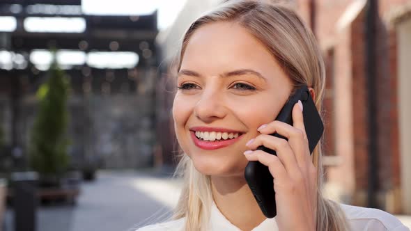 Close Up Young Business Woman Talking on Mobile Phone in City Street