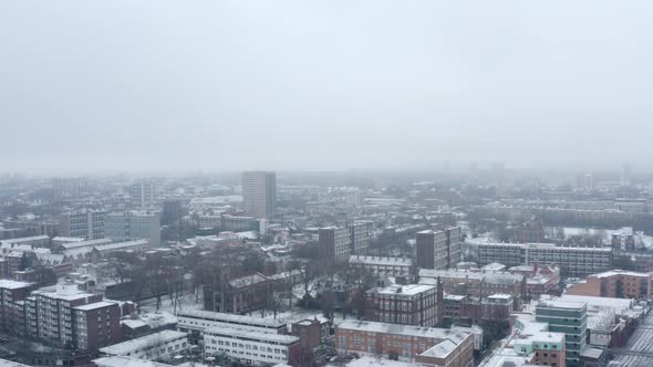 Aerial drone shot over residential London covered in heavy Snow Winter