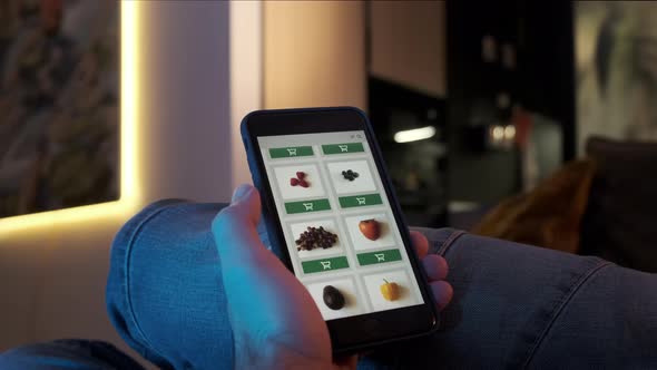 Ordering Food Vegetables and Fruits Online Using Smartphone App Close Up