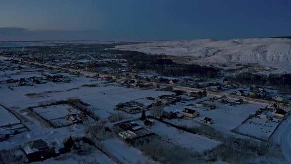 Russian Village in Winter Under a Bright Cloudy Sky