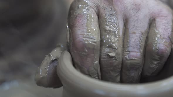 The sculptor male hands