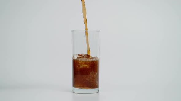 Super Slow Motion of Pouring Cola in Glass with Ice Shot at 1000 Fps