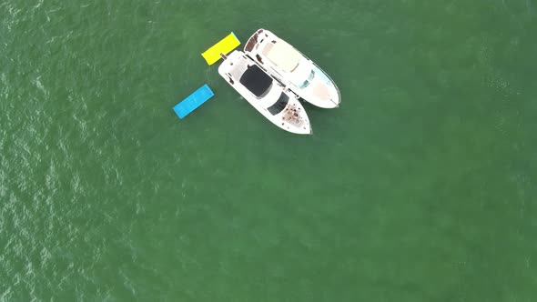 People on Tropical Caribbean Vacation Enjoying Time on Boats - Aerial